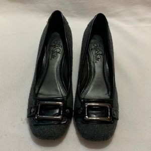 Grey felt texture, 1.5 in black leather heel, strap & silver buckle detail.